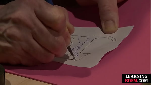 BDSM dom spanks brand onto his subject