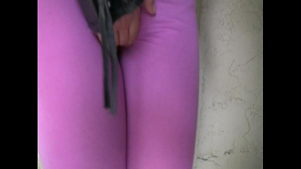 Blond girl pees her spandex leggings outside