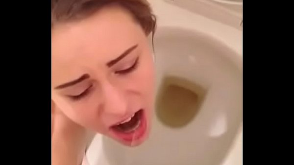 Hot brunette teen slut swallows boyfriends piss over toilet
